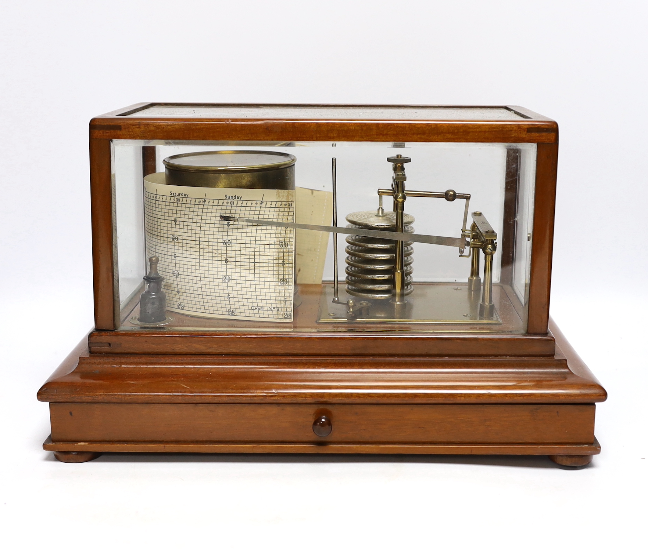 A 20th century barograph by Tycos, in a mahogany case with bevelled glass panels and incorporating an ink bottle and a drawer with spare graph papers, 36.5cm x 21.5cm